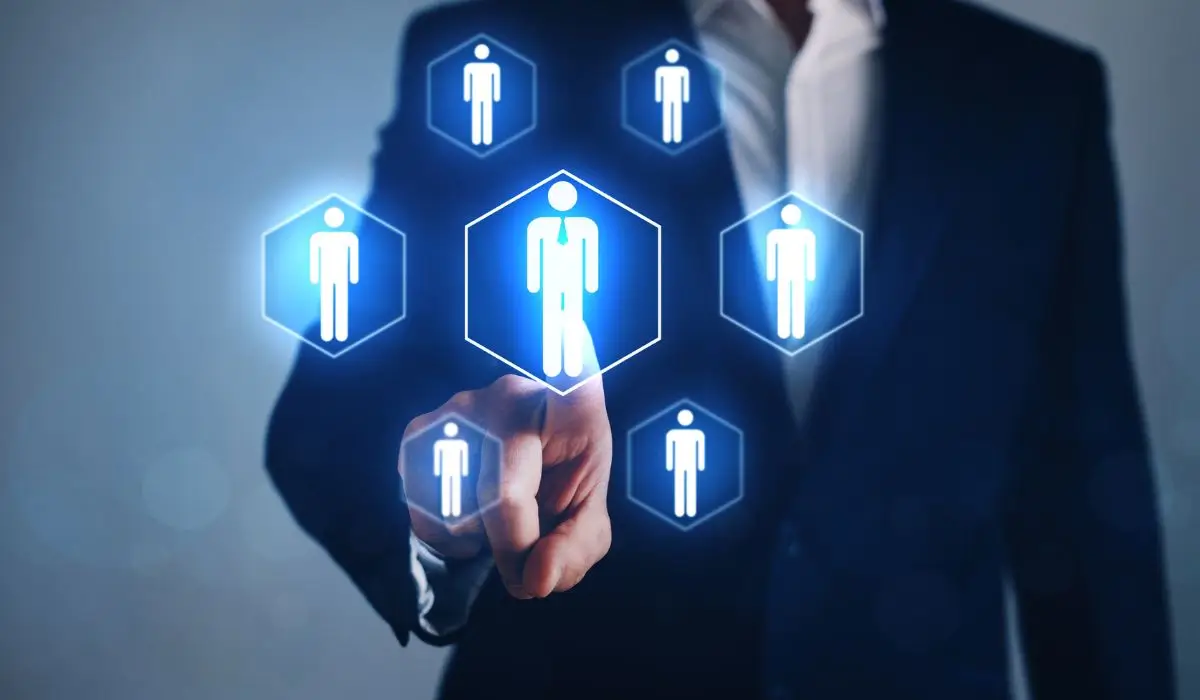 A business professional selecting a candidate through an AI-driven digital hiring interface, representing AI-powered human resource recruitment.