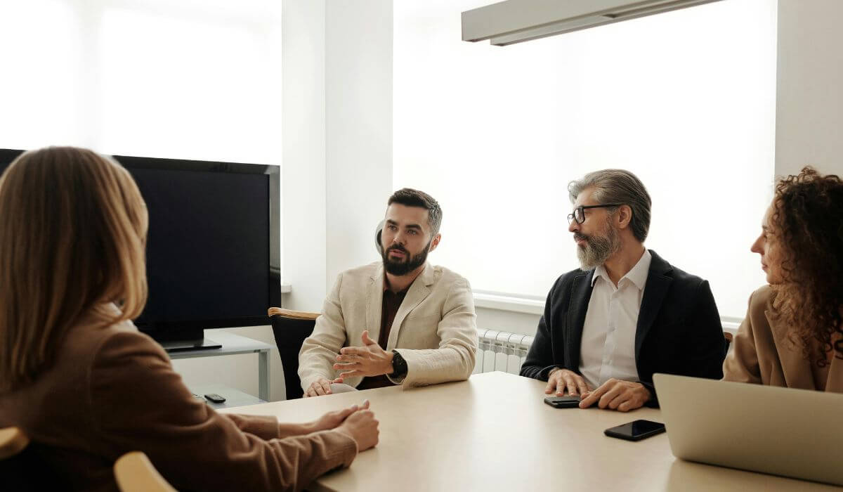 Business consultant meeting with executive team to discuss growth strategy.